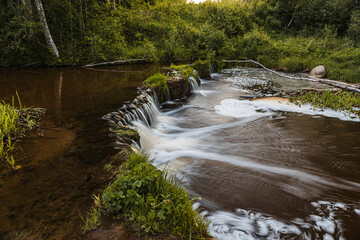 Beautiful running waterfall in the middle of the forest