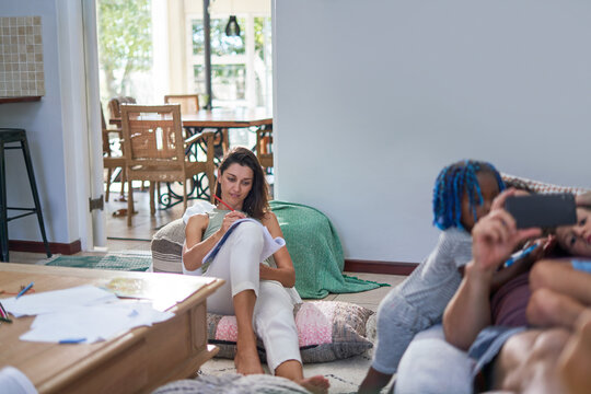 Family relaxing and playing games in living room