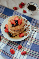 Pancake with strawberry and honey