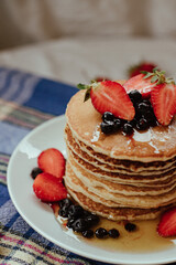 Pancake with strawberry and honey