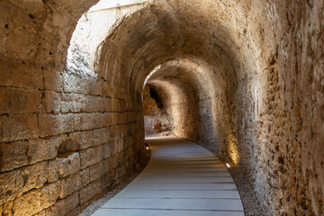 Fototapeta na wymiar Gallery under the steps of the Roman Theater of Cádiz. It was discovered in 1980 during excavations. It is the second largest theater in Roman Hispania, surpassed only by Córdoba by a few meters