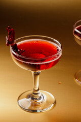 Sorrel in champagne coupe on gold background