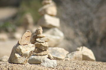 Stacked Stone Cairn Formations in the Desert left by Visitors to Joshua Tree, California, Leaving a Spiritual Community Connection