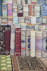 Carpets variety selection rolled up rugs shop store
