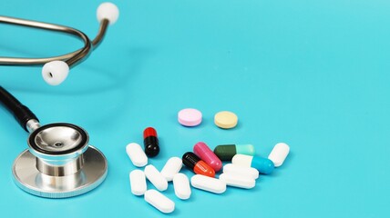 capsules of various colors with stethoscope