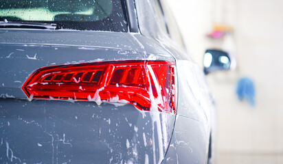 A view of a soapy windshield from inside of a car at the carwash