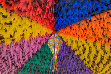 Colorful flags and decorative balloon for the Saint John party, which takes place in June in northeastern Brazil. - obrazy, fototapety, plakaty
