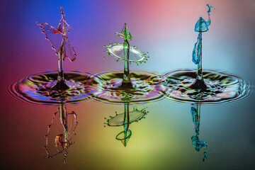Three droplet collisions
