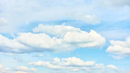 Sky with white summer cumulus clouds
