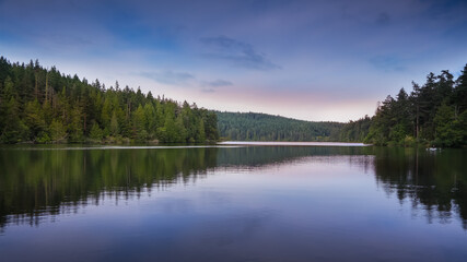 Fototapeta na wymiar Panoramic view of Pass lake landscape in twilight with perfect reflections
