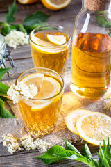 Organic refreshment juice from elderberry blossom on table