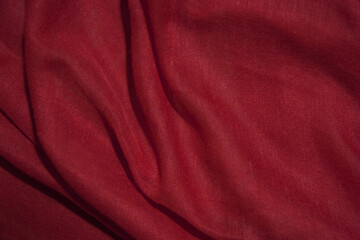 Obraz premium Red cotton fabric, soft and wavy.