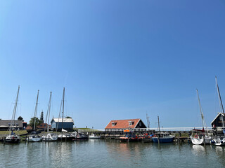 Fototapeta na wymiar The harbor of the city Hindeloopen in Friesland