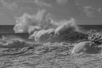 black and white seascape with big wave splash