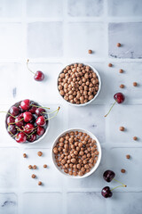 Fresh breakfast with chocolate balls with milk in a bowl