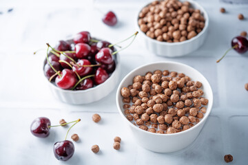Fresh breakfast with chocolate balls with milk in a bowl