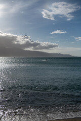 Seaside view of beach, summer vacation background.