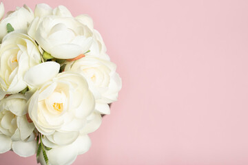 bouquet of roses on pink background