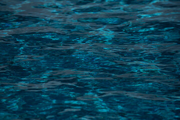 Tansparent clear calm water surface texture. Abstract nature background. Sea water pattern.