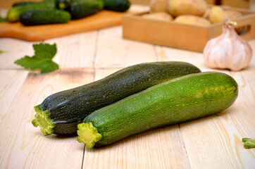 green zucchini and other vegetableson the kitchen table