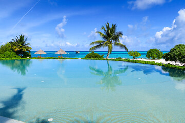 Infinity pool near beach, South Ari Atoll, Maldives