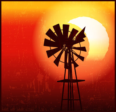 Farm windmill on an eclipse background