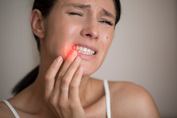 Young woman suffering from herpes on lips. Treatment of herpes infection and virus
