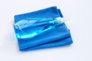 Window cleaner in plastic bottle with blue towel