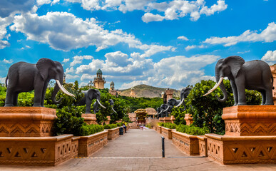 Entrance of The Palace / Lost City /Sun City with stone statues under blue and cloudy sky © shams Faraz Amir