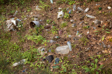 Pile of garbage in nature. Plastic rubbish in forest on meadow