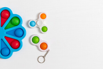 Color pop it anti stress toy for children. rainbow heart shaped isolated on white background . Pop it toy.