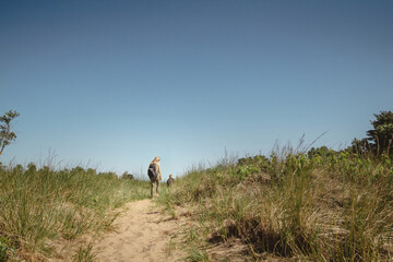 Mother and young son walking along a path at Indiana Dunes State Park