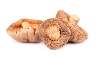 Dried shiitake mushrooms, isolated on white background. Japanese forest mushroom. Lentinula edodes. Close up.