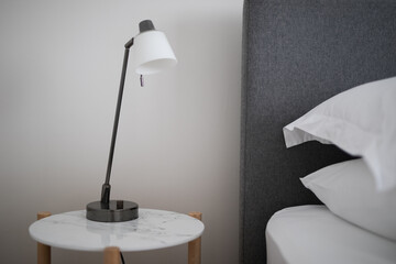 glass white bedside lamp table bedroom bed pillow linen sleep rest home