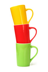 red, yellow and green cups on white background