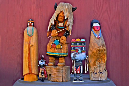 Group of traditional and non traditional katsina (Kachina) with wood background.