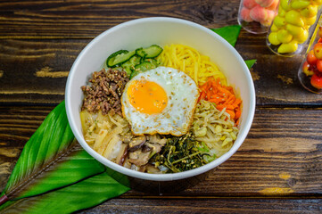 Korean food bibimbap with vegetables and fried egg