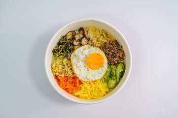 Korean food bibimbap with vegetables and fried egg
