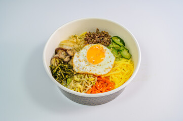 Korean food bibimbap with vegetables and fried egg