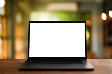 Fototapeta premium laptop on the table,office background for light bokeh. 