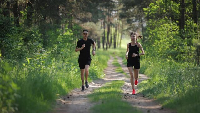 Young people running at forest