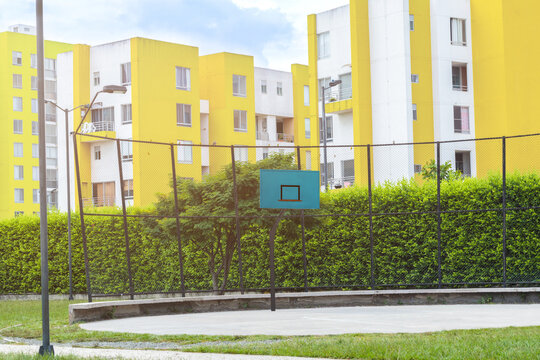 basketball court without people and with pantone colored buildings