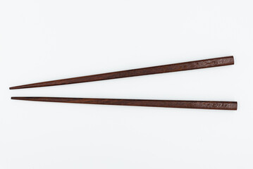 Isolated wooden chopsticks on white background