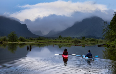 Adventure Friends Kayaking in Kayak surrounded by Canadian Mountain Landscape. Cloudy Sky Art Render. Taken in Widgeon Valley, Pitt Meadows, Vancouver, British Columbia, Canada.