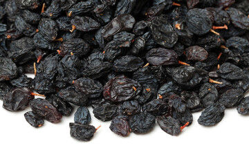 black raisins on a white background 