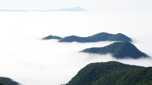 Hokkaido,Japan - June 24, 2021: View of cloud sea and Kunashiri island from Shiretoko Pass, Hokkaido, Japan

