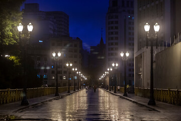 Blured of rainy night view of the iron grid of the Santa Ifigenia viaduct in downtown of Sao Paulo,