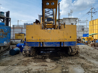 Fototapeta premium Cranes on the construction site area industry machine of drilling piles