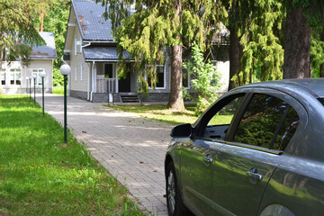 Country one-story cottages with a lawn and a driveway, designed for recreation in the forest