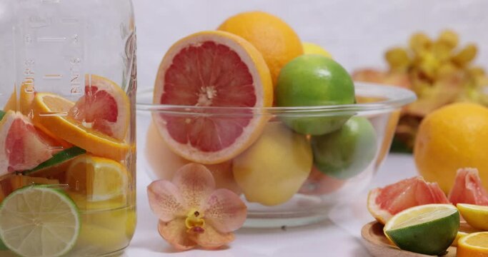 Making citrous fruits infusion water with lime, lemon, orange and grapefruit.